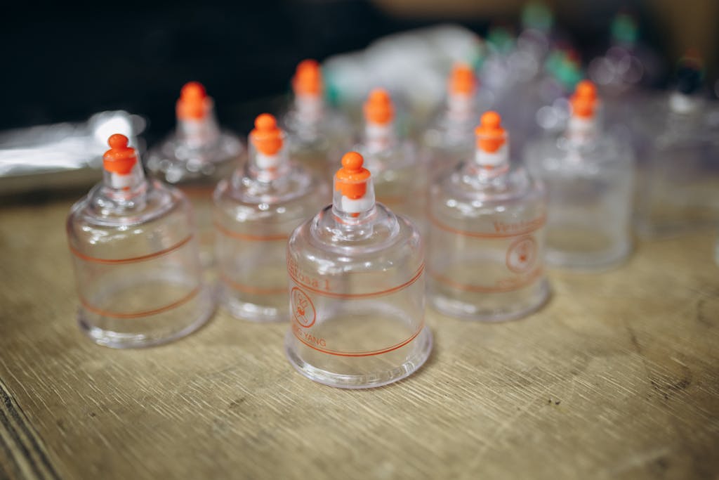 Close-up view of multiple cupping therapy cups used for massage and muscle recovery.